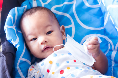 Happy asian mother playing with newborn outdoor, mum and child having fun together - Family,...
