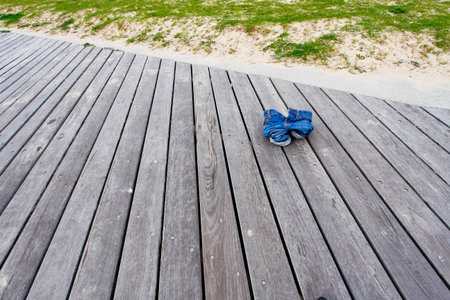 Child spread jeans forget to leave the seaside.の写真素材