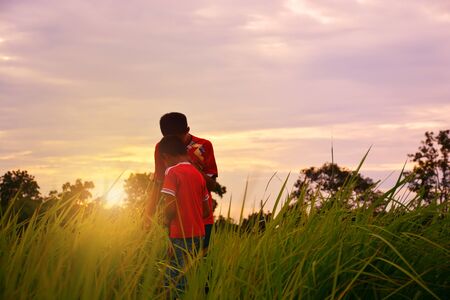 two brother playing on the Sunsetのeditorial素材