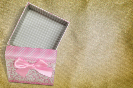 Open gift box on vintage background, top view, space for textの写真素材