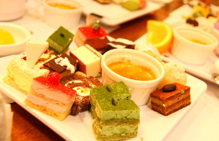 colorful cakes and desserts with dip sauceの写真素材