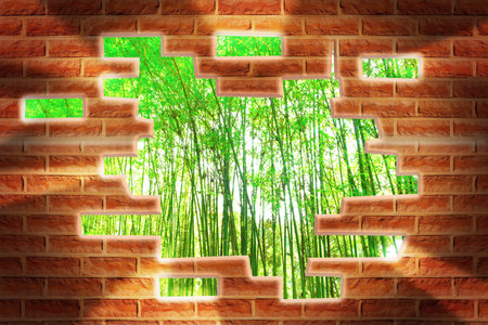 Broken Brick Wall with beautiful landscape behindの写真素材