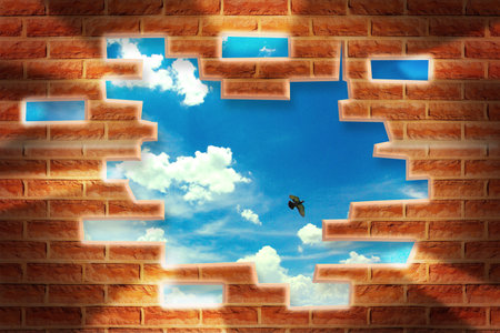 Broken Brick Wall with beautiful landscape behindの写真素材