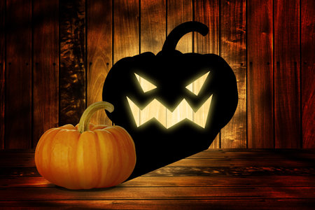 halloween pumpkin on old dark wood backgroundの写真素材