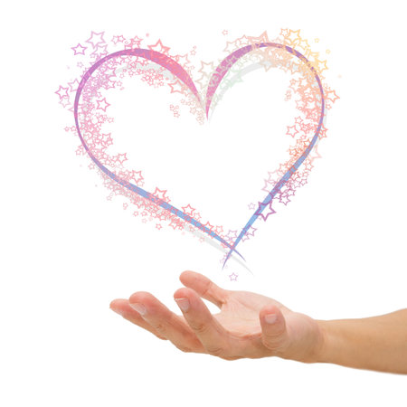 heart shape of light on hand, love conceptの写真素材