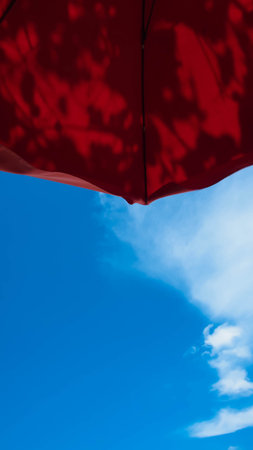 tropical day sky with an umbrella on summer for backgrondの写真素材