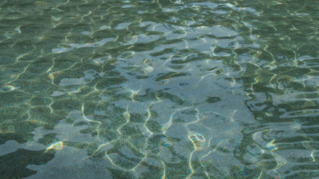 beautiful clear ripple water surface reflecting in the sun