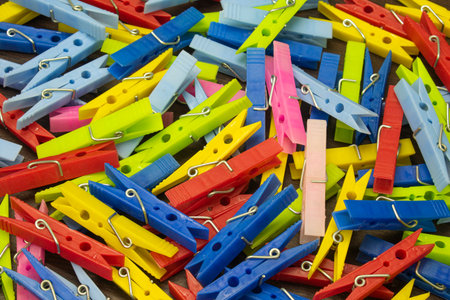 Colorful clothes pegs on the tableの写真素材