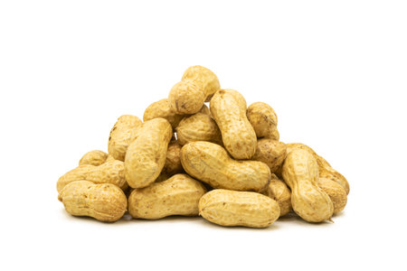 Heap of fresh peanuts on isolated white background