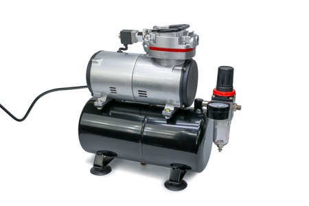 Mini air compressor on isolated white backgroundの写真素材