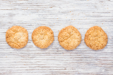 Oatmeal cookies on a light wooden backgroundの写真素材