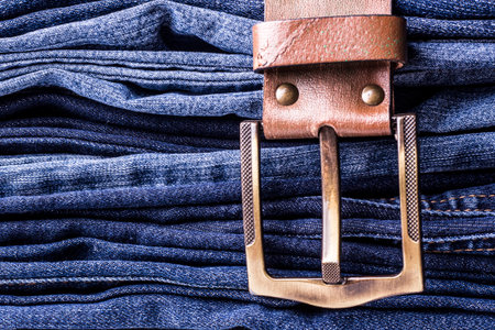Jeans background. Texture. Leather beltの写真素材