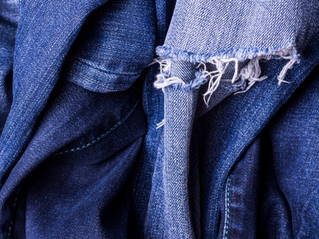 Jeans background. Texture. The holes in the fabric.の写真素材