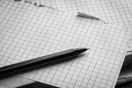 Pen and pages in cage. Concept of education. Black and white photographyの写真素材