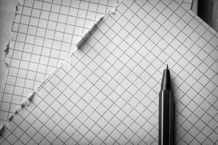 Pen and pages in cage. Concept of education. Black and white photographyの写真素材