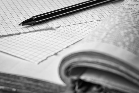 Pen and pages in cage. Concept of education. Black and white photographyの写真素材