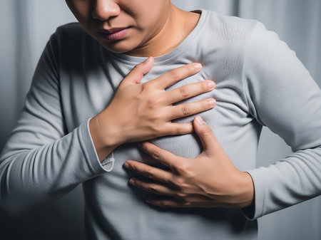 woman suffering from heart attack and chest pain, heart attack concept.の素材