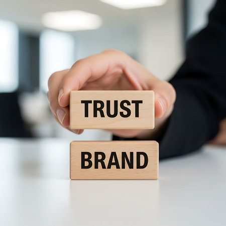 Hand holding wooden block with trust above brand conceptの素材