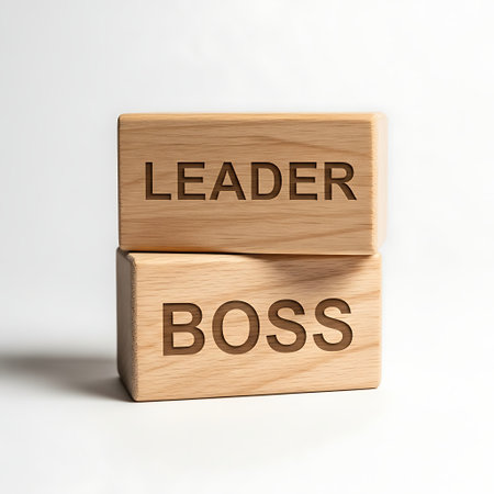 Wooden block with word leader stacked on block with word boss isolated on white backgroundの素材