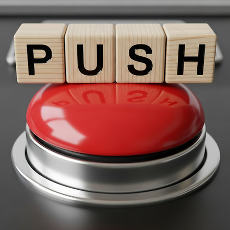 Wooden block spelling push above a large red emergency stop buttonの素材