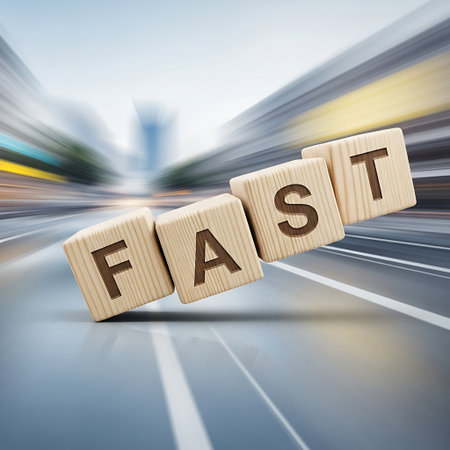 Wooden blocks spelling fast on a blurred, fastmoving city roadの素材