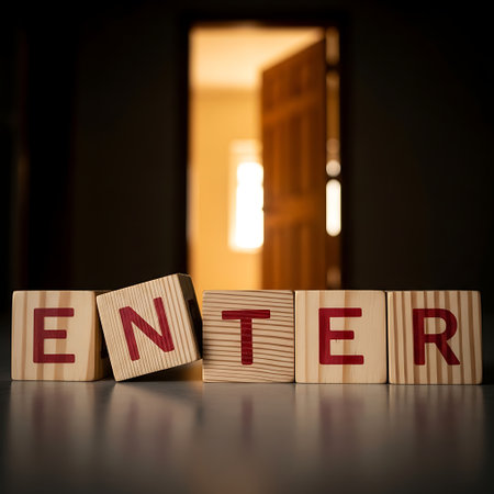 Wooden block spelling enter in front of an open doorwayの素材