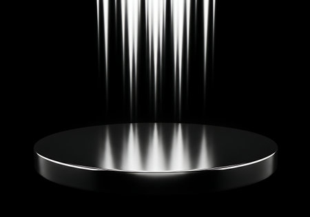 Spotlight shining down on a reflective black circular stageの素材