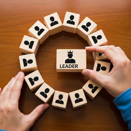 Hands arranging wooden blocks to show a leader in a circleの素材