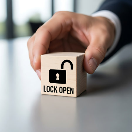 Hand placing wooden cube with open lock icon and text lock openの素材