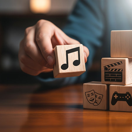Hand placing wooden block with music note among media iconsの素材
