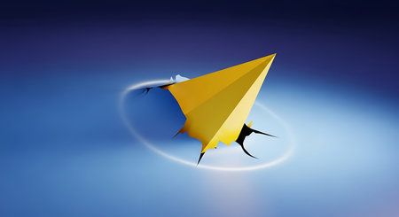Yellow paper airplane breaking through a blue surfaceの素材