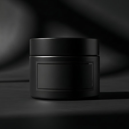 Black cosmetic jar mockup with blank label in dramatic dark studio lightingの素材