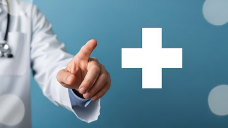 Doctor pointing at a white plus sign symbol representing health care or first aidの素材