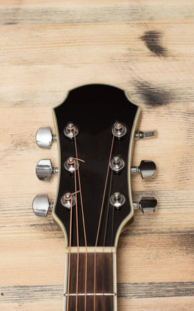 Guitar Neck on the old wooden table wallの写真素材