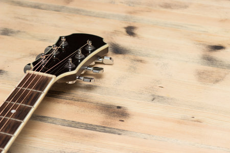Guitar Neck on the old wooden table wallの写真素材