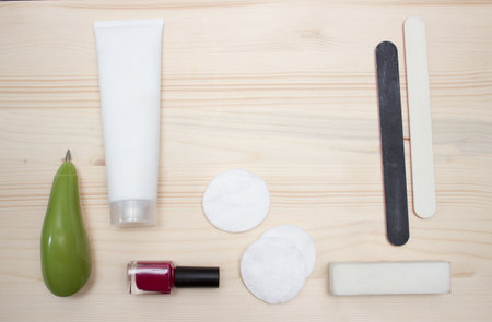 Manicure and pedicure tools on light wooden backgroundの写真素材