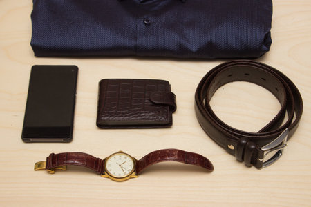 Men's clothes style accessories and gajets on wooden backgroundの写真素材