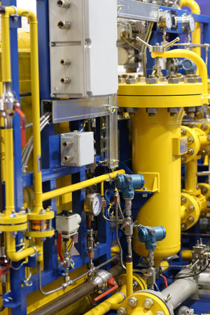 Close up of yellow barometer in natural gas production industry