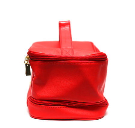 Red leasure make up bag isolated on white background, profile viewの写真素材
