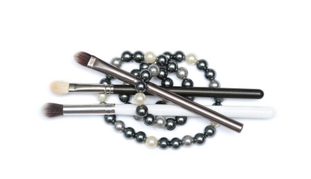 Three MakeUp brushes with beading isolated on white background. Black, silver and white brush.の写真素材