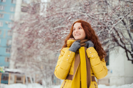 Outdoor portrait of pretty young girl in winter