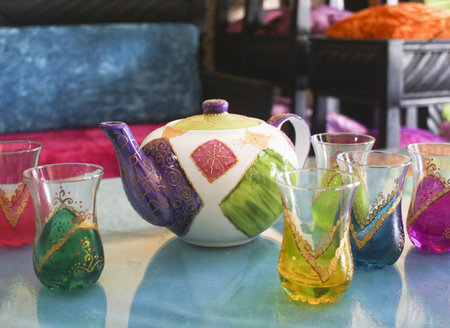 morrocan tea set displayed on blue  tableの写真素材