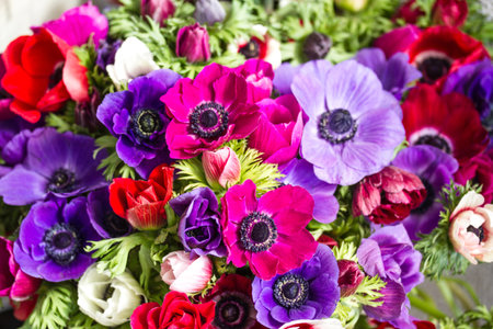 colorful buttercups bouquet, natural backgroundの写真素材