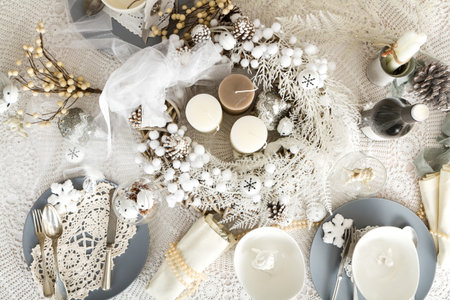 Beautifully set table in white shabby chic for Christmas Eveの写真素材
