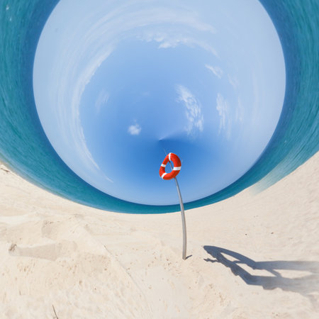A life buoy at the beach of Faro from a tiny world perspectiveの写真素材