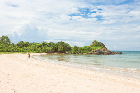Balapitiya, Sri Lanka, Asia - A woman in a bay at the beach of Balapitiyaの写真素材