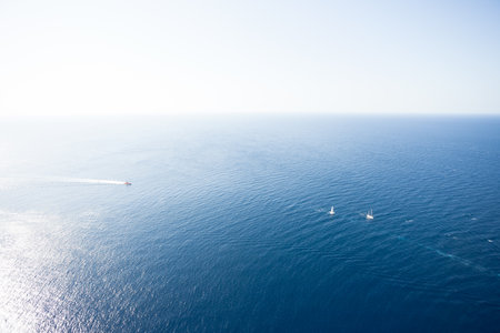 Cap de Formentor, Mallorca, Spain - Farsightedness across the Mediterranean Sea onto some boatsの写真素材