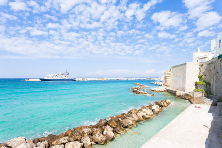 Otranto, Apulia, Italy - Sunbathing at the quay of Otranto in Italyの写真素材