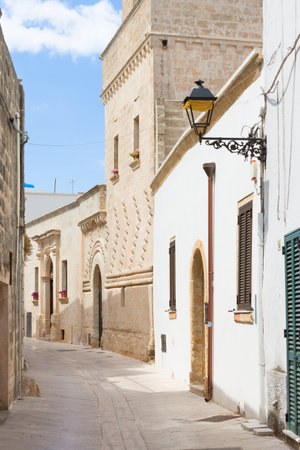 Presicce, Apulia, Italy - Walking through an old alleyway in Presicceの写真素材