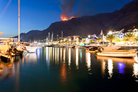Makarska, Dalmatia, Croatia, Europe - A wildfire in the mountains of Makarska at nightの写真素材